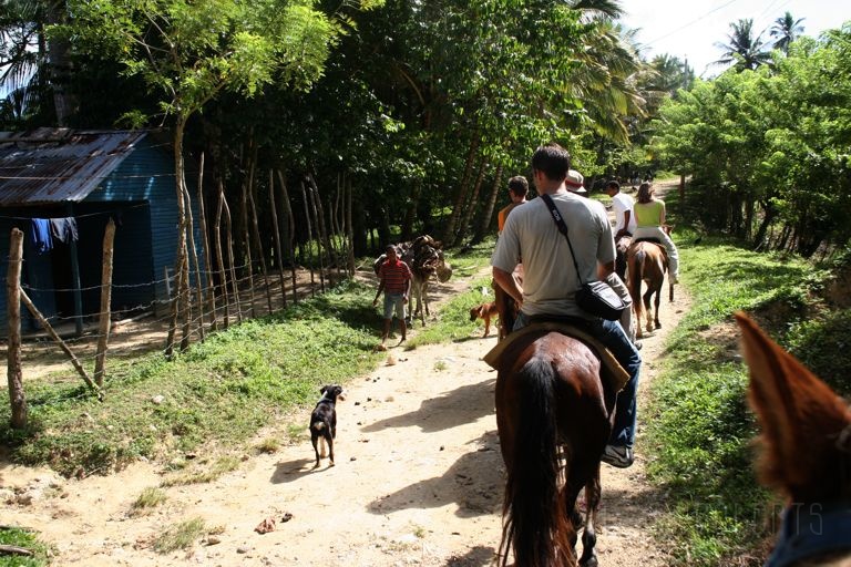 IMG_1494.jpg - Here we are on our horseback riding adventure going through a very small village.